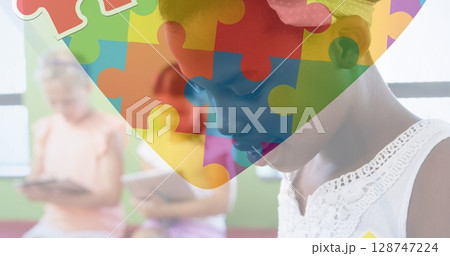 Image of puzzle over diverse schoolchildren Image of puzzle over diverse schoolchildren 128747224