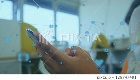 Image of network of connections over person using smartphone 128747491