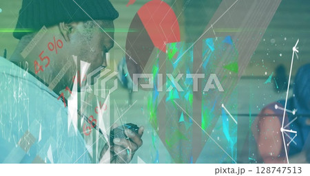 Image of connections and graphs over male trainer on box ring Image of connections and graphs over male trainer on box ring 128747513