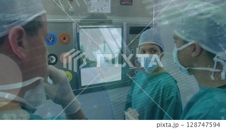 Statistical data processing over team of diverse surgeons discussing in operation theatre Statistical data processing over team of diverse surgeons discussing in operation theatre 128747594