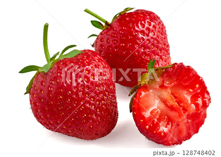 three red appetizing strawberries isolated on a white background three red appetizing strawberries isolated on a white background 128748402