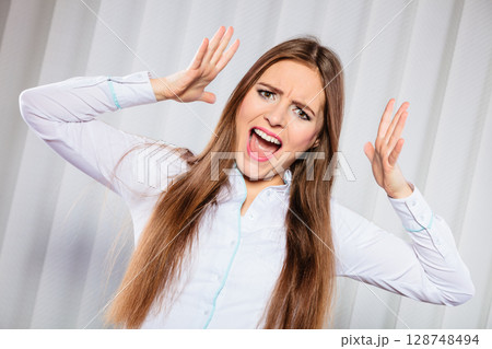 Angry young woman shout. 128748494