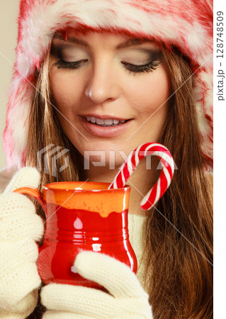 Christmas girl with mug and cane. 128748509