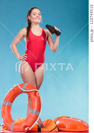 Lifeguard woman on duty with ring buoy lifebuoy. Lifeguard woman on duty with ring buoy lifebuoy. 128748518