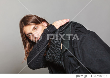 Handsome fashion man portrait wearing black coat. 128748987