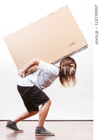 Delivery man holding a paper box. Delivery man holding a paper box. 128748997
