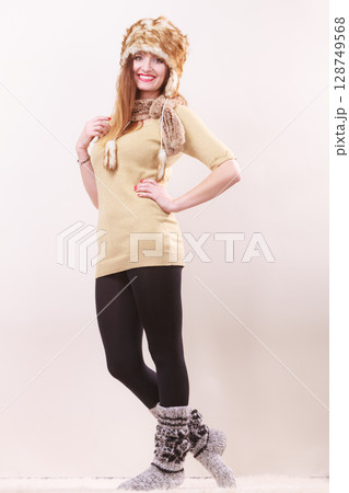 Beautiful winter woman in warm clothing Beautiful winter woman in warm clothing 128749568