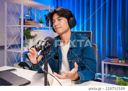 Podcast host sharing opinion in studio 128752589