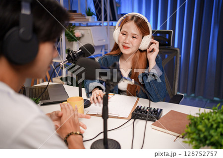 People in the podcast studio talking and recording People in the podcast studio talking and recording 128752757