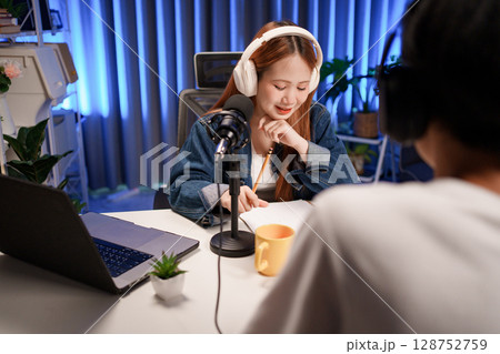 People in the podcast studio talking and recording People in the podcast studio talking and recording 128752759