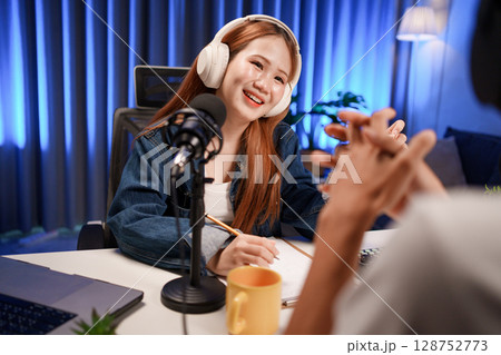 People in the podcast studio talking and recording People in the podcast studio talking and recording 128752773