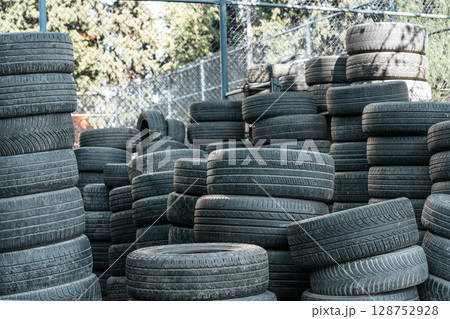 Used Worn Out Car Tires Piled Outdoors 128752928
