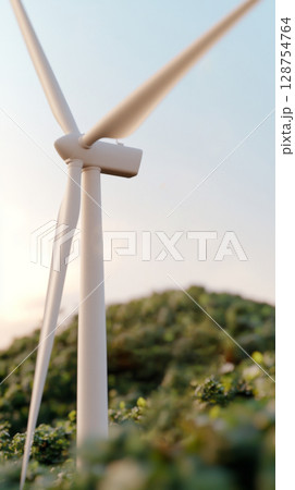 Wind turbine on hilltop with clear sky, renewable energy concept 128754764