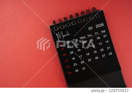 March black desk calendar for 2026 year on red cover background with copy space. 128755017