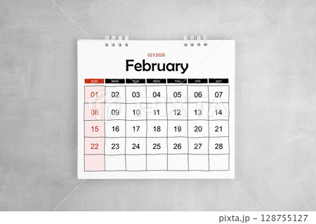 February 2026 desk calendar on gray cement wall background. Page of annual monthly calendar February 2026 desk calendar on gray cement wall background. Page of annual monthly calendar 128755127