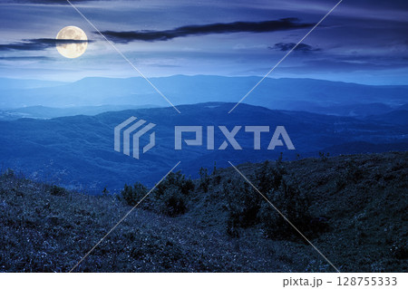 mountain landscape in summer at night. beautiful view of rolling green hills and alpine meadows in full moon light. scenery with clouds on the dark sky. scenic nature background for travel mountain landscape in summer at night. beautiful view of rolling green hills and alpine meadows in full moon light. scenery with clouds on the dark sky. scenic nature background for travel 128755333