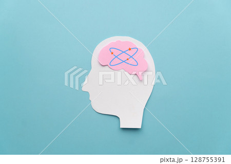 Human head with dizzy stars brain on blue background. Concept of dizziness, vertigo, headache, stress, confuse and hangover. Human head with dizzy stars brain on blue background. Concept of dizziness, vertigo, headache, stress, confuse and hangover. 128755391
