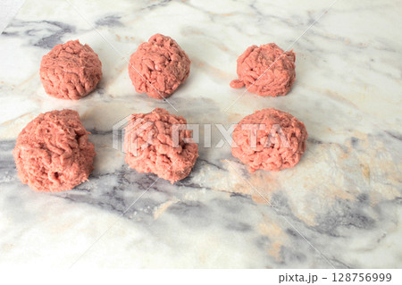 meatballs, meat balls lying on a light background, close-up. Cooking meatballs meatballs, meat balls lying on a light background, close-up. Cooking meatballs 128756999
