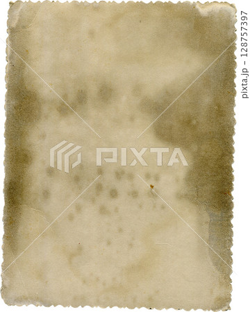 Old weathered parchment with distressed, torn edges. Authentic vintage paper surface. 128757397