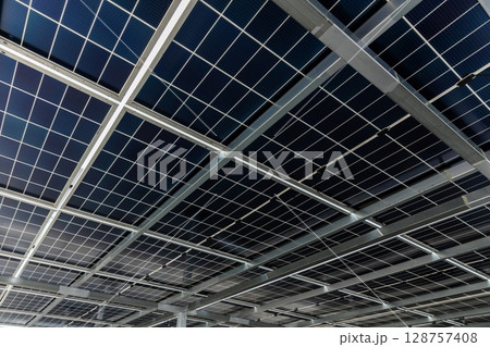 Solar cell photovoltaic panels technology for renewable energy solution on roof. Electrical energy obtained from nature sunlight clean renewable energy. Solar cell photovoltaic panels technology for renewable energy solution on roof. Electrical energy obtained from nature sunlight clean renewable energy. 128757408