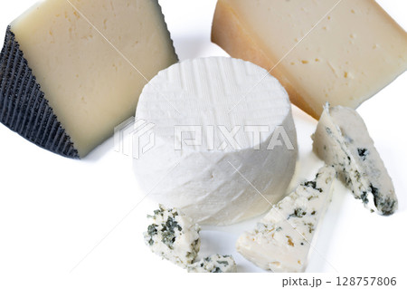 Different cheeses with nuts, figs and grapes Different cheeses with nuts, figs and grapes 128757806
