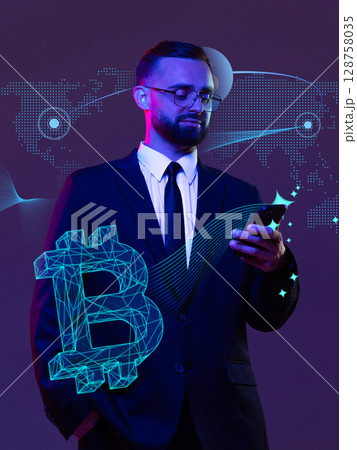 Businessman checking crypto app on the phone with bitcoin hologram in purple neon lightning 128758035
