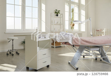 Empty cosmetologist's office with equipment in clinic of dermatology and cosmetology. Empty cosmetologist's office with equipment in clinic of dermatology and cosmetology. 128759466