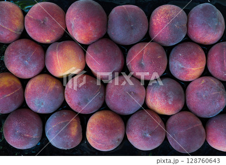 Ripe peaches in box Ripe peaches in box 128760643