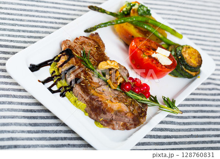 Veal with grilled vegetables 128760831