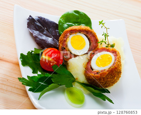 Scotch eggs with vegetables 128760853