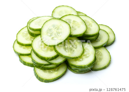 Photo of small bunch of green ripe natural organic cucumber sliced into circles isolated on white background 128761475
