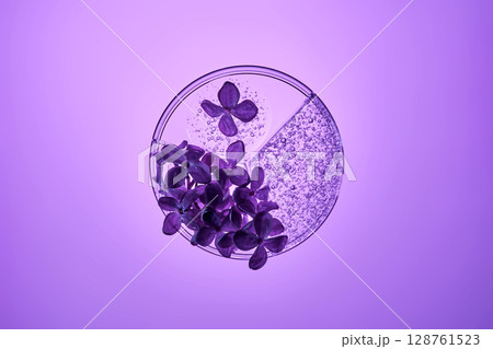 A petri dish with a beautiful serum texture on a purple background with lilac flowers. 128761523