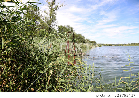 Landscape with a river outside the city Landscape with a river outside the city 128763417