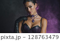 Glamorous Woman in Purple Sequin Dress and Gloves 128763479