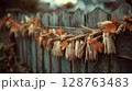 Autumnal Decoration on Rustic Wooden Fence 128763483
