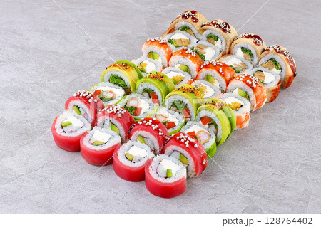 Assorted Colorful Sushi Roll Medley Featuring Shrimp Mango Avocado Cream Cheese 128764402