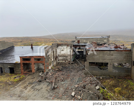 A building with a lot of rubble and debris. A building with a lot of rubble and debris. 128764979