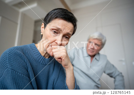 Upset female enduring verbal aggression from unstable partner showing signs of emotional breakdown 128765145