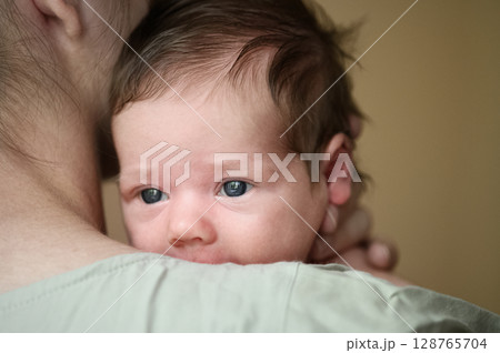 Tender Moment Between Mother and Newborn Baby 128765704