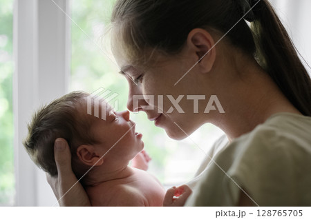 Tender Moment Between Mother and Newborn Baby Tender Moment Between Mother and Newborn Baby 128765705