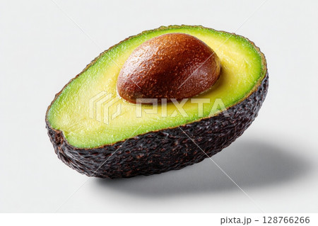 Photorealistic Ripe Avocado Half with Seed on White Background 128766266