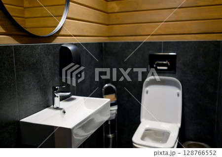 Bathroom with wood trim and modern equipment 128766552