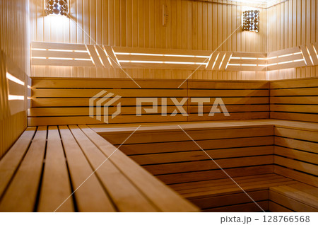 Empty Sauna room background. Wooden sauna, spa room. Empty Sauna room background. Wooden sauna, spa room. 128766568
