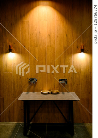 Sauna interior with wooden walls and benches 128766574