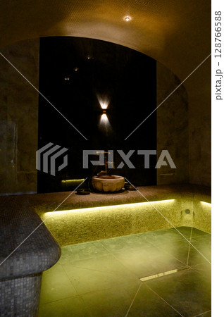 Interior of a hammam sauna with stone finishing and lighting Interior of a hammam sauna with stone finishing and lighting 128766588