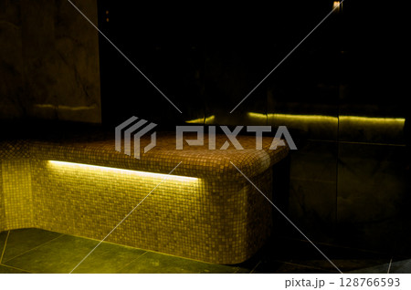 Interior of a hammam sauna with stone finishing and lighting 128766593