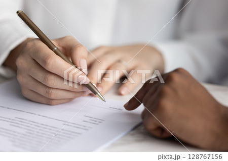 Client signing contract, authorizing service agreement, close up 128767156