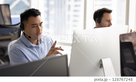 Callcenter or helpline employee provide solutions, sales support to clients 128767248