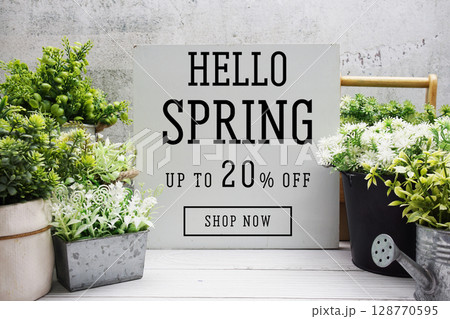 Hello Spring Sale 20% off Promotion Offer Discount Retail Shopping Concept 128770595