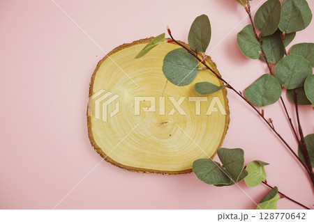 wooden podium product display stands flat lay with leaves top view on pink background wooden podium product display stands flat lay with leaves top view on pink background 128770642